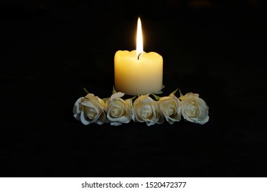 beautiful-white-roses-burning-candle-260nw-1520472377.jpg